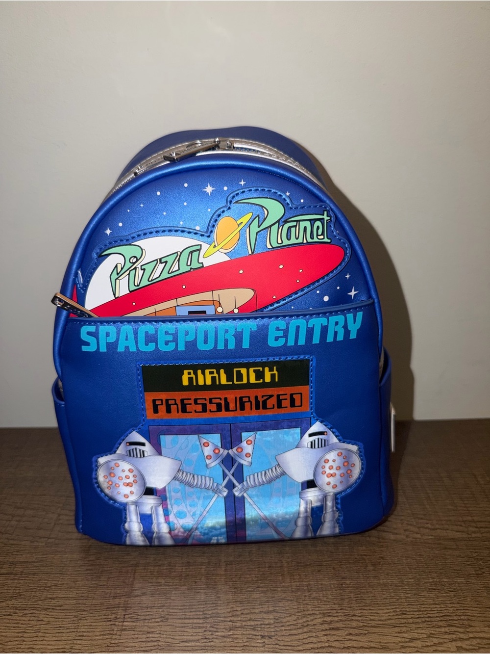 Loungefly Disney Toy Story Pizza Planet Backpack - glows in dark